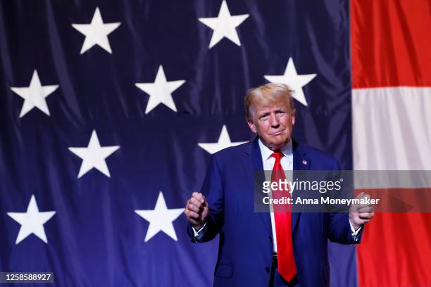Former U.S. President Donald Trump arrives to deliver remarks during the Georgia state GOP convention at the Columbus Convention and Trade Center on...