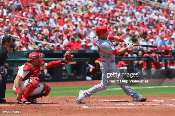 Luke Maile of the Cincinnati Reds drives in three runs with a double against the St. Louis Cardinals in the second inning at Busch Stadium on June...