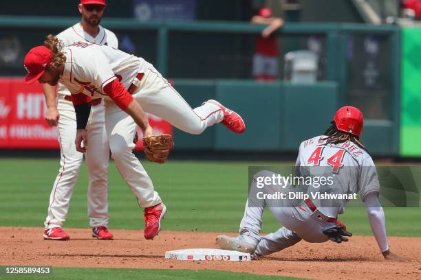 Brendan Donovan of the St. Louis Cardinals beats Elly De La Cruz of the Cincinnati Reds to second base for an out in the third inning at Busch...