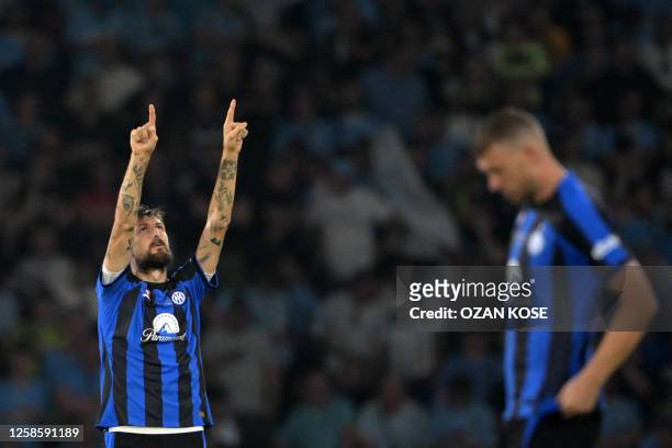 Inter Milan's Italian defender Francesco Acerbi gestures to the fans during the UEFA Champions League final football match between Inter Milan and...