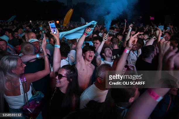 Manchester City fans celebrate after their club beat Inter Milan to win the UEFA Champions League final football match in Istanbul at 4TheFans Fan...