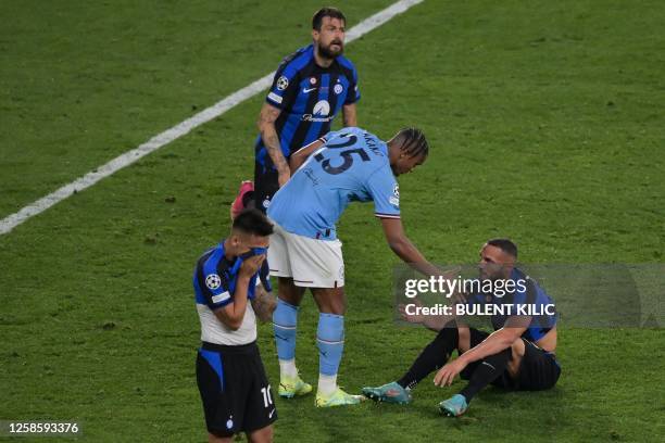 Manchester City's Swiss defender Manuel Akanji shakes hands with Inter Milan's Italian defender Danilo D'Ambrosio at the end of the UEFA Champions...