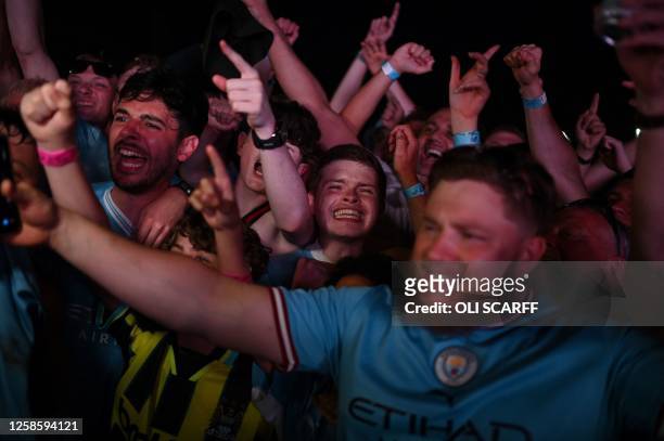 Manchester City fans celebrate after their club beat Inter Milan to win the UEFA Champions League final football match in Istanbul at 4TheFans Fan...