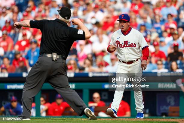 Manager Rob Thomson of the Philadelphia Phillies is thrown out of the game by third base umpire Bill Miller during the sixth inning against the Los...