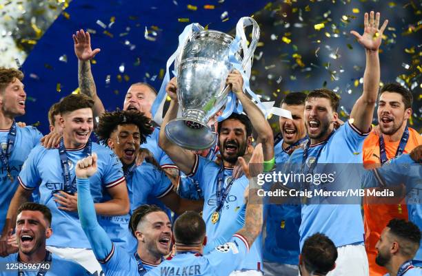 Ilkay Gundogan of Manchester City lifts the trophy and celebrates with team mates after the UEFA Champions League 2022/23 final match between FC...