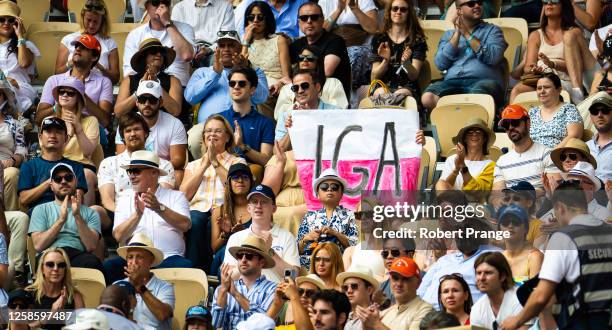 Fans cheer on Iga Swiatek of Poland during the Women's singles final on Day Fourteen of Roland Garros on June 10, 2023 in Paris, France
