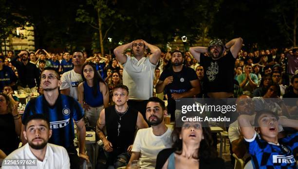 Internazionale supporters react in dejection at the end of the UEFA Champions League final match against Manchester City at a cafe in Milan, Italy on...