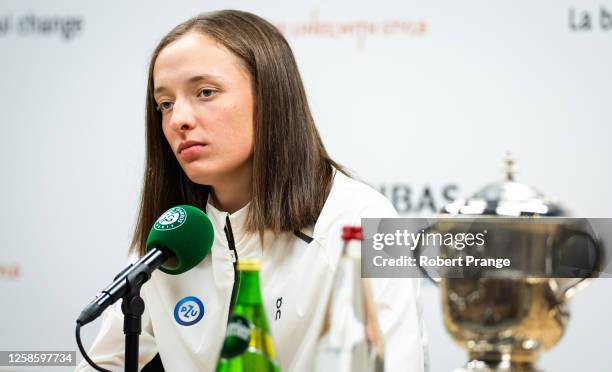 Iga Swiatek of Poland talks to the media after defeating Karolina Muchova of the Czech Republic in the Women's singles final on Day Fourteen of...