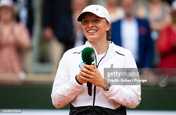 Iga Swiatek of Poland during the trophy ceremony after defeating Karolina Muchova of the Czech Republic on Day Fourteen of Roland Garros on June 10,...