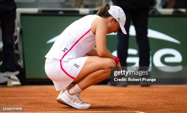 Iga Swiatek of Poland reacts to defeating Karolina Muchova of the Czech Republic in the Women's singles final on Day Fourteen of Roland Garros on...