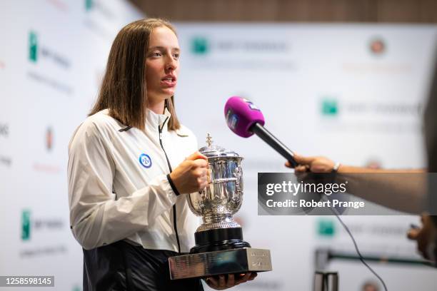 Iga Swiatek of Poland talks to the media after defeating Karolina Muchova of the Czech Republic in the Women's singles final on Day Fourteen of...