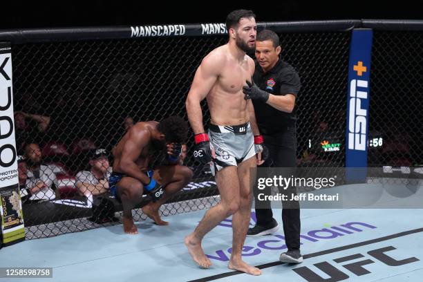 Chris Curtis reacts to a headbutt from Nassourdine Imavov of Russia in their middleweight fight during the UFC 289 event at Rogers Arena on June 10,...