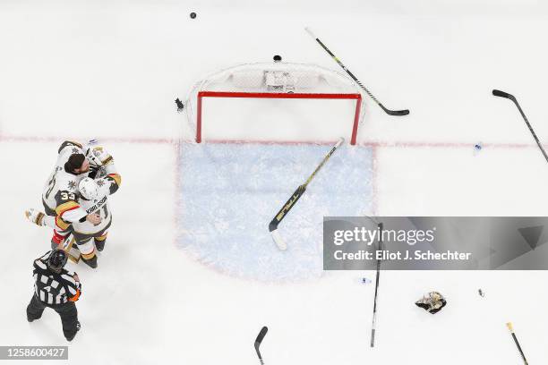 Goaltender Adin Hill and William Karlsson of the Vegas Golden Knights embrace after their 3-2 win over the Florida Panthers in Game Four of the 2023...