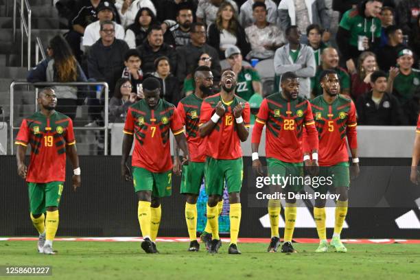 Karl Toko Ekambi of Cameroon, center, celebrates after scoring a goal during the second half of the Mextour soccer match against Mexico June 10, 2023...