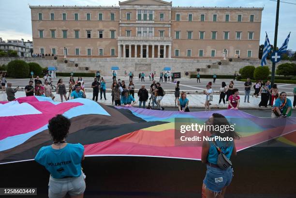 Participants wave a giant rainbow flag in front of the Greek Parliament during the Pride Parade in Athens, Greece on June 10, 2023. Thousands march...