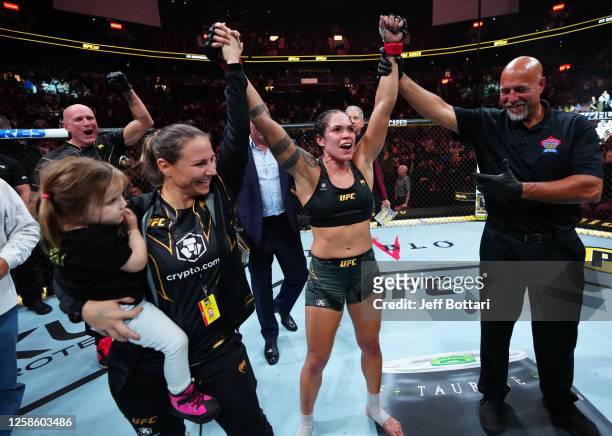 Amanda Nunes of Brazil celebrates her victory over Irene Aldana of Mexico in their women's bantamweight title fight during the UFC 289 event at...