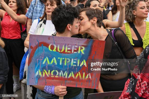 Participants kiss each other during the Pride Parade in Athens, Greece on June 10, 2023. Thousands march in Athens Pride Parade 2023 with the motto...