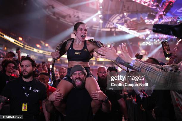 Amanda Nunes of Brazil celebrates her victory over Irene Aldana of Mexico in their women's bantamweight title fight during the UFC 289 event at...