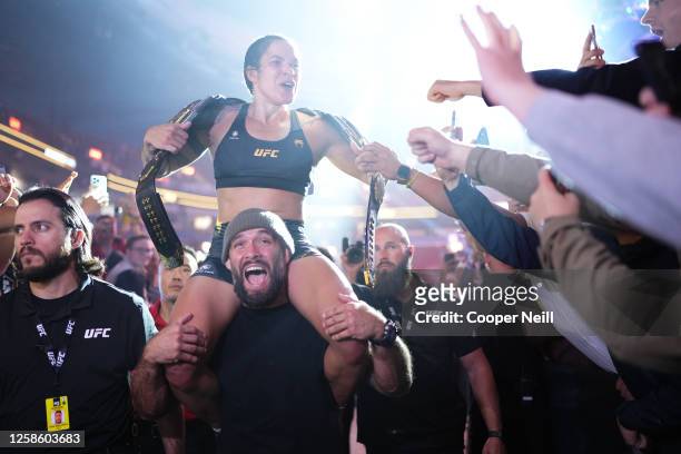Amanda Nunes of Brazil celebrates her victory over Irene Aldana of Mexico in their women's bantamweight title fight during the UFC 289 event at...