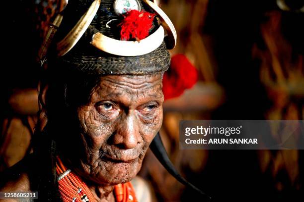 This photograph taken on April 8, 2023 shows a Konyak tribesman during a community gathering in Hongphoi village, in the northeast Indian state of...