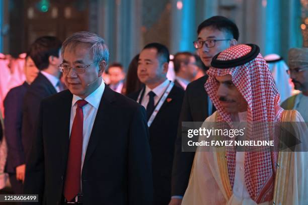 Saudi Foreign Minister Faisal bin Farhan al-Saud and Vice Chairman of the Chinese People's Political Consultative Conference Hu Chunhua attend 10th...