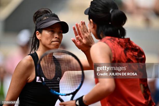 Tapei's Hsieh Su-wei celebrates a point with China's Wang Xinyu as they play against Canada's Leylah Fernandez and US Taylor Townsend during their...