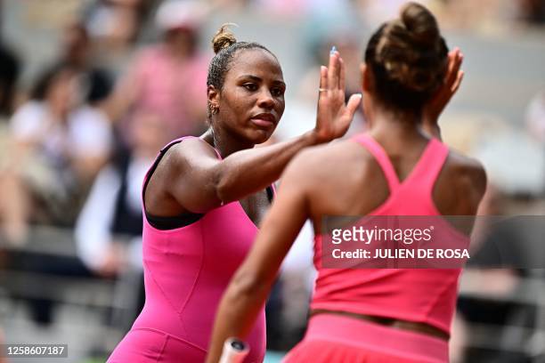 Canada's Leylah Fernandez celebrates a point with US Taylor Townsend as they play against China's Wang Xinyu and Tapei's Hsieh Su-wei during their...