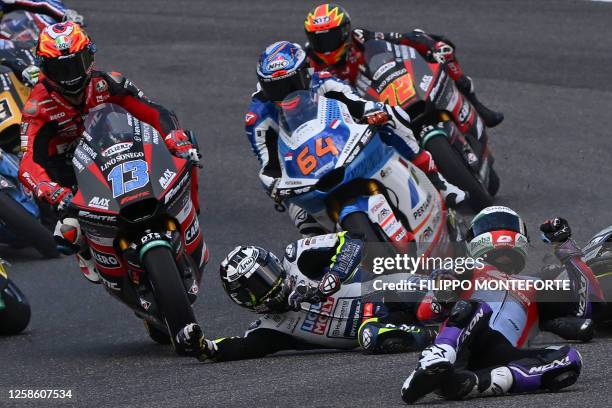 Riders crash during the Italian Moto2 Grand Prix race at Mugello Circuit in Mugello, on June 11, 2023.