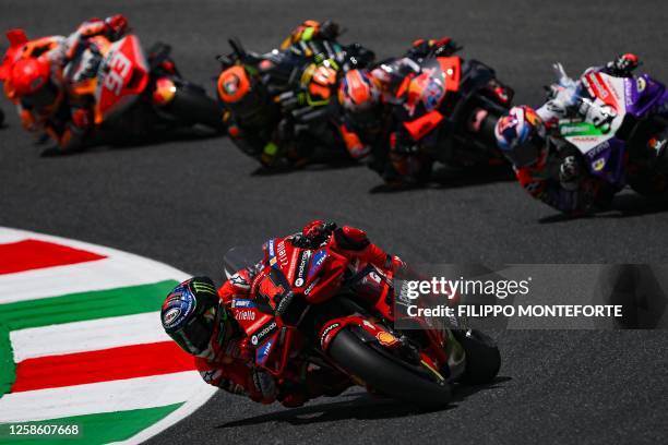 Ducati Italian rider Francesco Bagnaia leads others at the start of the race during the Italian MotoGP race at Mugello Circuit in Mugello, on June...