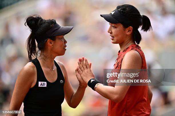 Tapei's Hsieh Su-wei celebrates a point with China's Wang Xinyu as they play against Canada's Leylah Fernandez and US Taylor Townsend during their...