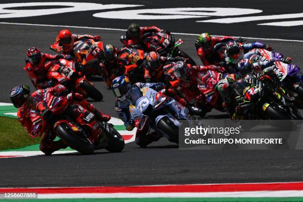 Pack of riders compete at the start of the race during the Italian MotoGP race at Mugello Circuit in Mugello, on June 11, 2023.