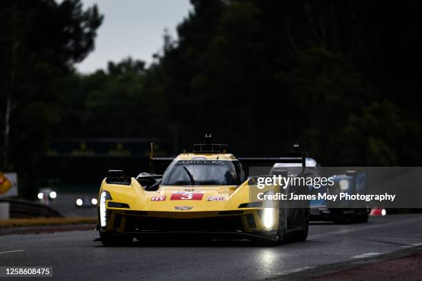 The Cadillac Racing Cadillac V-Series.R of Sebastien Bourdais, Renger Van der Zande, and Scott Dixon in action during the 100th anniversary of the 24...