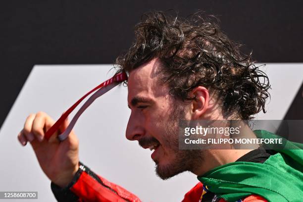 Ducati Italian rider Francesco Bagnaia reacts as he celebrates after winning the Italian MotoGP race at Mugello Circuit in Mugello, on June 11, 2023.