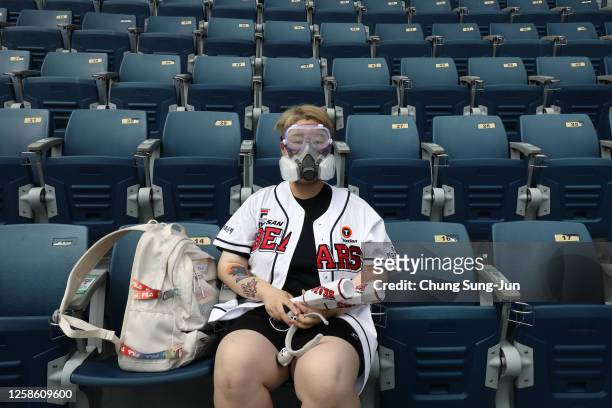 Doosan Bears fan wearing a goggle and mask ahead the KBO League game between LG Twins and Doosan Bears at the Jamsil Stadium on July 26, 2020 in...