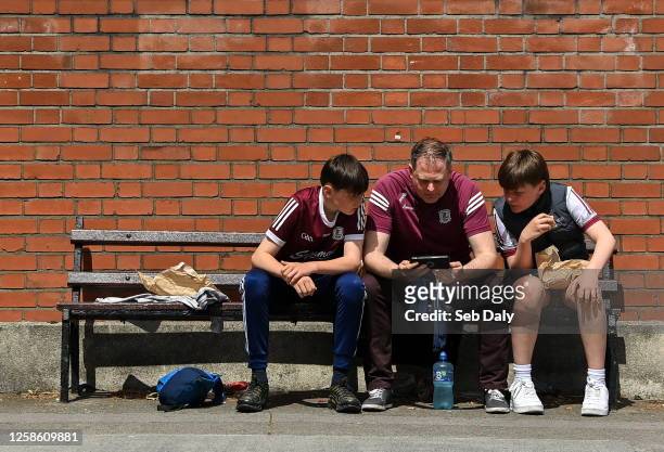 Dublin , Ireland - 11 June 2023; Galway supporters the Moran family, from left, Oisin, Cathal, and Owen, from Portumna, Galway, watch the watch the...