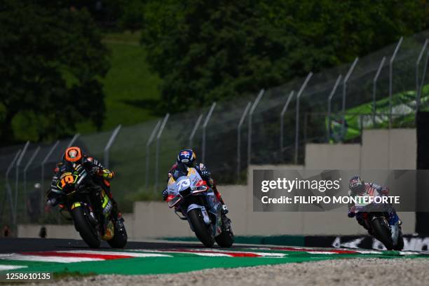 Ducati Italian rider Luca Marini, Ducati Spanish rider Alex Marquez, and Ducati French rider Johann Zarco compete during the Italian MotoGP race at...