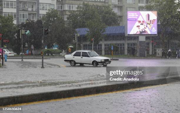 View of a flooded street after heavy rains hit Ankara, Turkiye on June 11, 2023. Vehicles had difficulty in advancing due to the water, some vehicles...