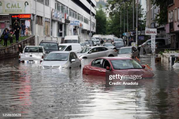 View of a flooded street after heavy rains hit Ankara, Turkiye on June 11, 2023. Vehicles had difficulty in advancing due to the water, some vehicles...