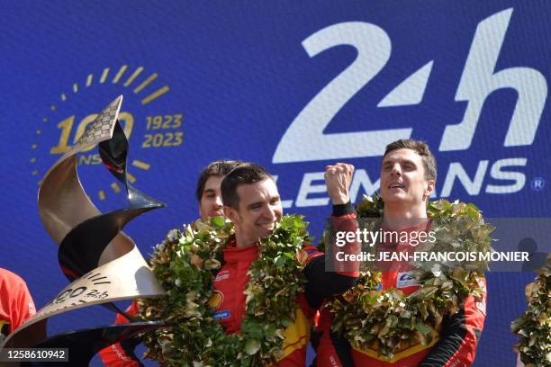 Ferrari N.51 499P Hypercar drivers Italian Antonio Giovinazzi, Italian Alessandro Pier Guidi and British James Calado celebrate on the podium after...