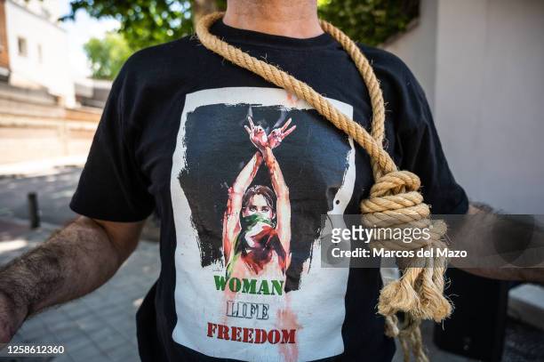 Man protesting with a rope around his neck during a demonstration outside the Iranian embassy in Madrid demanding to stop relationships with the...