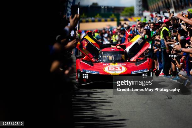 Race winners, the AF Corse Ferrari 499P of James Calado, Alessandro Pier Guidi, and Antonio Giovinazzi arrive down the pit lane towards parc ferme at...