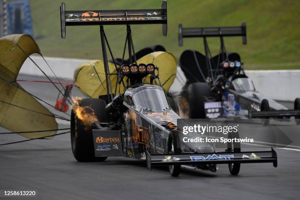 The parachutes come out as Austin Prock Montana Brand/Rocky Mountain Twist Top Fuel Dragster slows at the top end during the first round of...