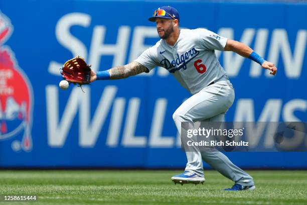 Left fielder David Peralta of the Los Angeles Dodgers can't catch a ball hit by Bryce Harper of the Philadelphia Phillies during the first inning of...