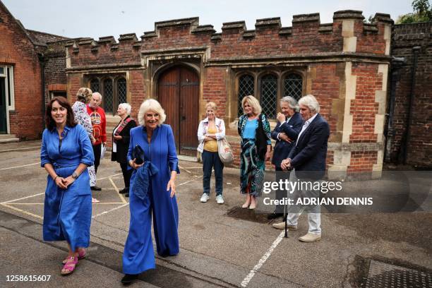 Britain's Queen Camilla arrives to attend a reception for the inaugural Queen's Reading Room Literary Festival at Hampton Court Palace, East Molesey...