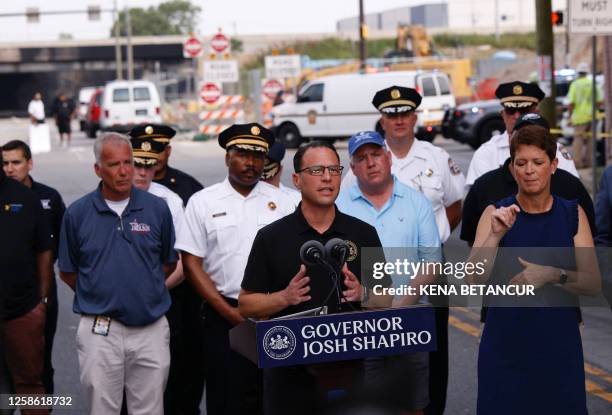 Pennsylvania Governor Josh Shapiro speaks to members of the media near a collapsed portion of Interstate 95, caused by a large vehicle fire, in...