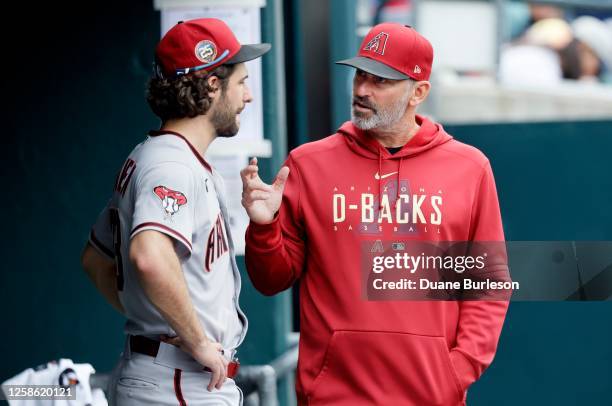 Manager Torey Lovullo of the Arizona Diamondbacks talks with starting pitcher Zac Gallen in the seventh inning against the Detroit Tigers at Comerica...