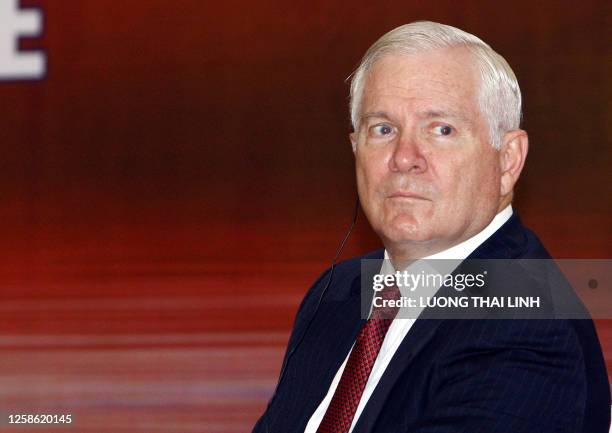 Secretary of Defense Robert Gates attends a signing ceremony at the end of the ASEAN defense ministers' meeting with their main counterparts in Hanoi...