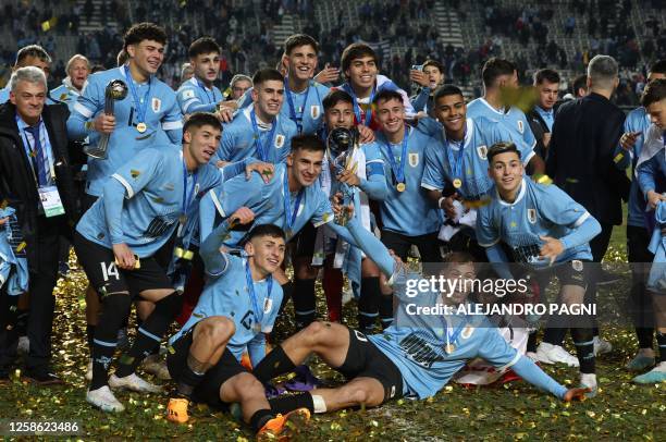 Players of Uruguay pose for a picture with the trophy after defeating Italy and winning the Argentina 2023 U-20 World Cup at the Estadio Unico Diego...