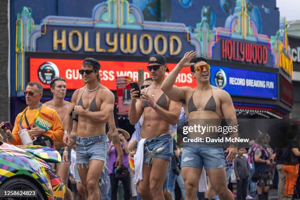 People participate in the annual LA Pride Parade on June 11, 2023 in the Hollywood section of Los Angeles, California. The LA Pride Parade is one of...