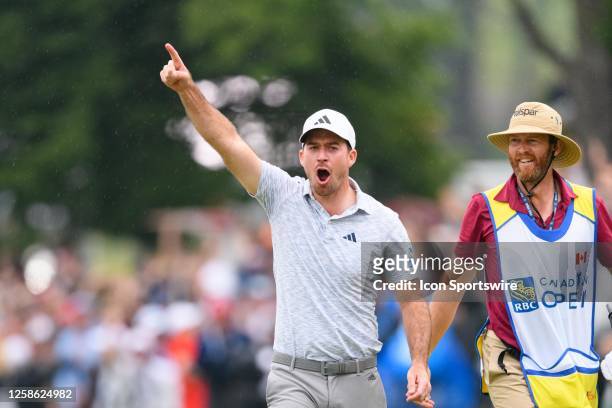 Nick Taylor of Canada celebrates celebrates after making an eagle putt on the 4th playoff hole to win the RBC Canadian Open at Oakdale Golf & Country...